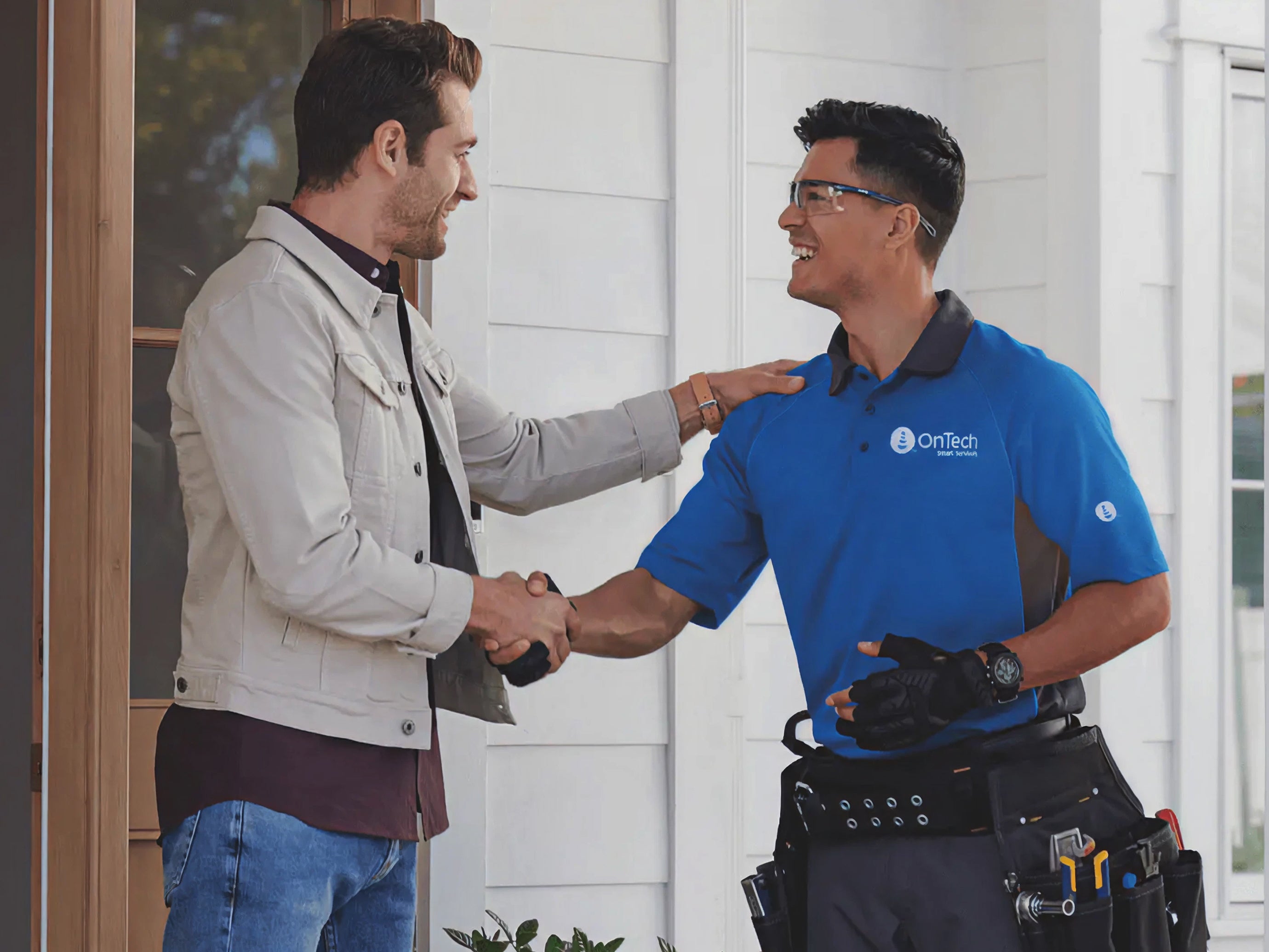 OnTech technician shaking hands with homeowner